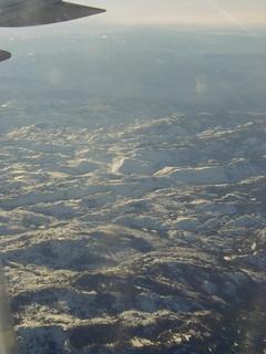 Snow covered mountains in the Sierra Nevada<br>Location: <a href="https://www.google.com/maps/search/?api=1&query=38.24216,-119.85754" target="_new">Over California</a>